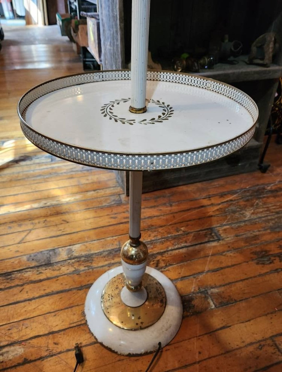 Center table and base showing tarnish, wear, and rust spots.