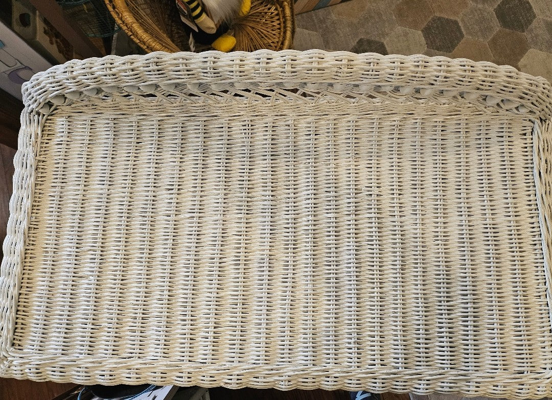 Top of wicker desk showing some anomalies and color fading