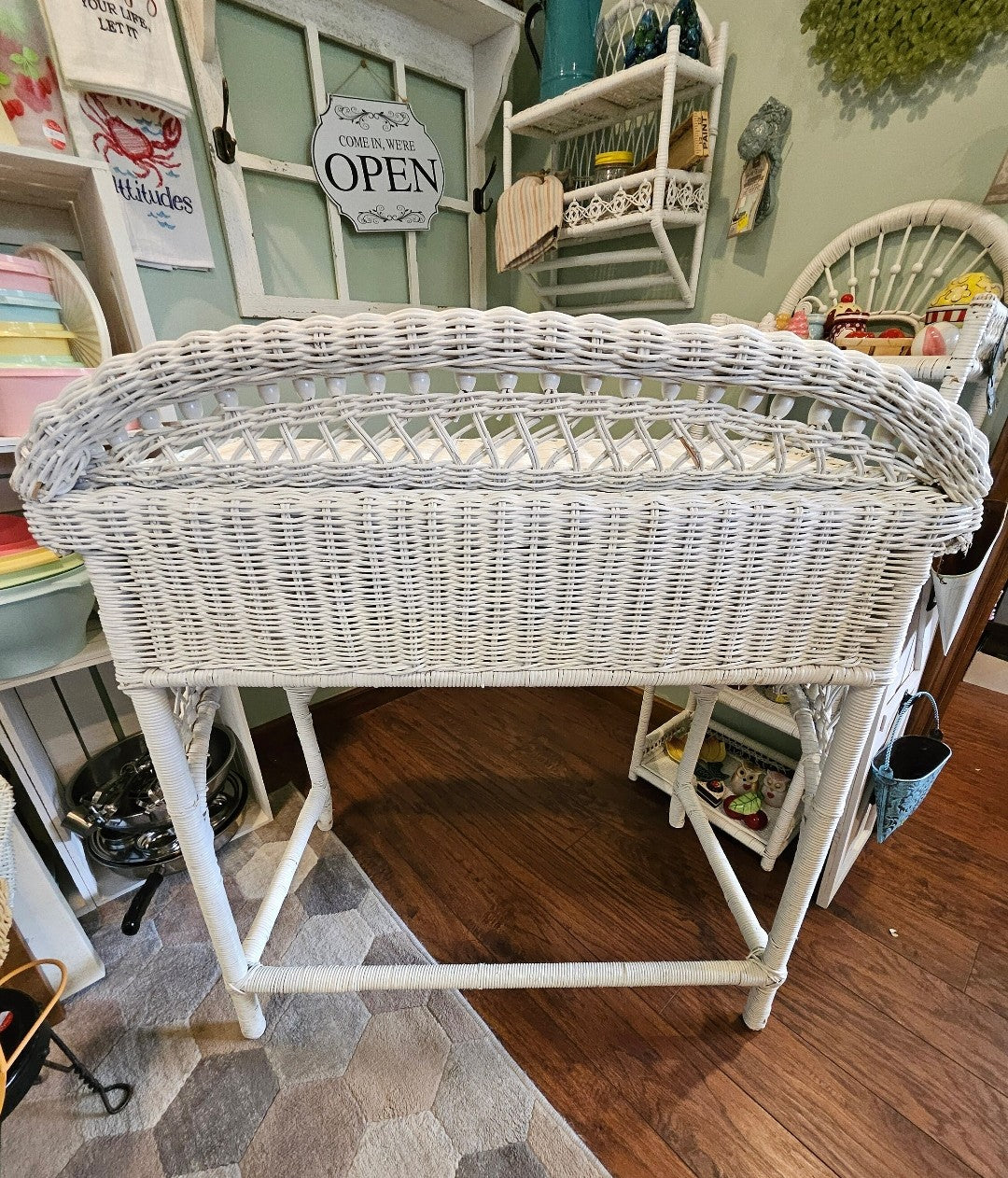Back view of vintage white wicker desk