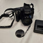 Picture of black Canon camera with accessories