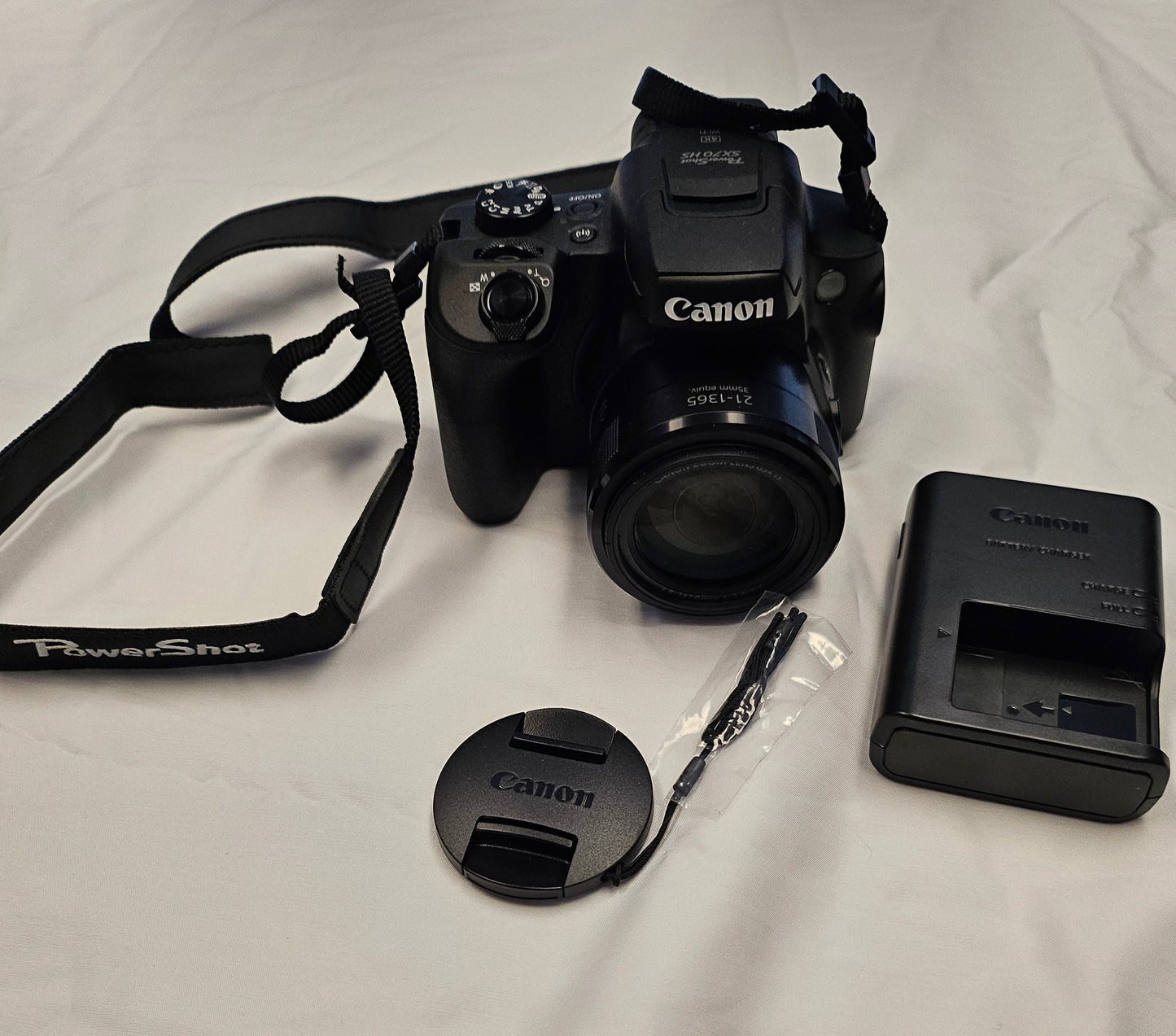 Picture of black Canon camera with accessories