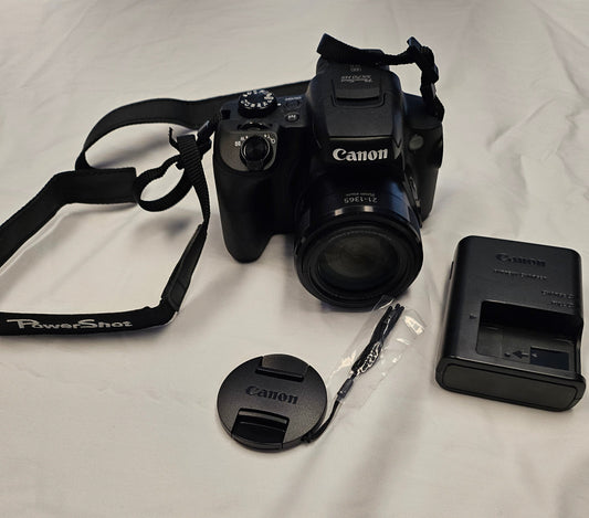 Picture of black Canon camera with accessories