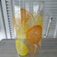Pyrex glass pitcher with lemon and orange slice motif