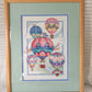 Full view of framed cross stitched hot air balloon wall decor