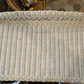 Top of wicker desk showing some anomalies and color fading