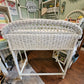 Back view of vintage white wicker desk